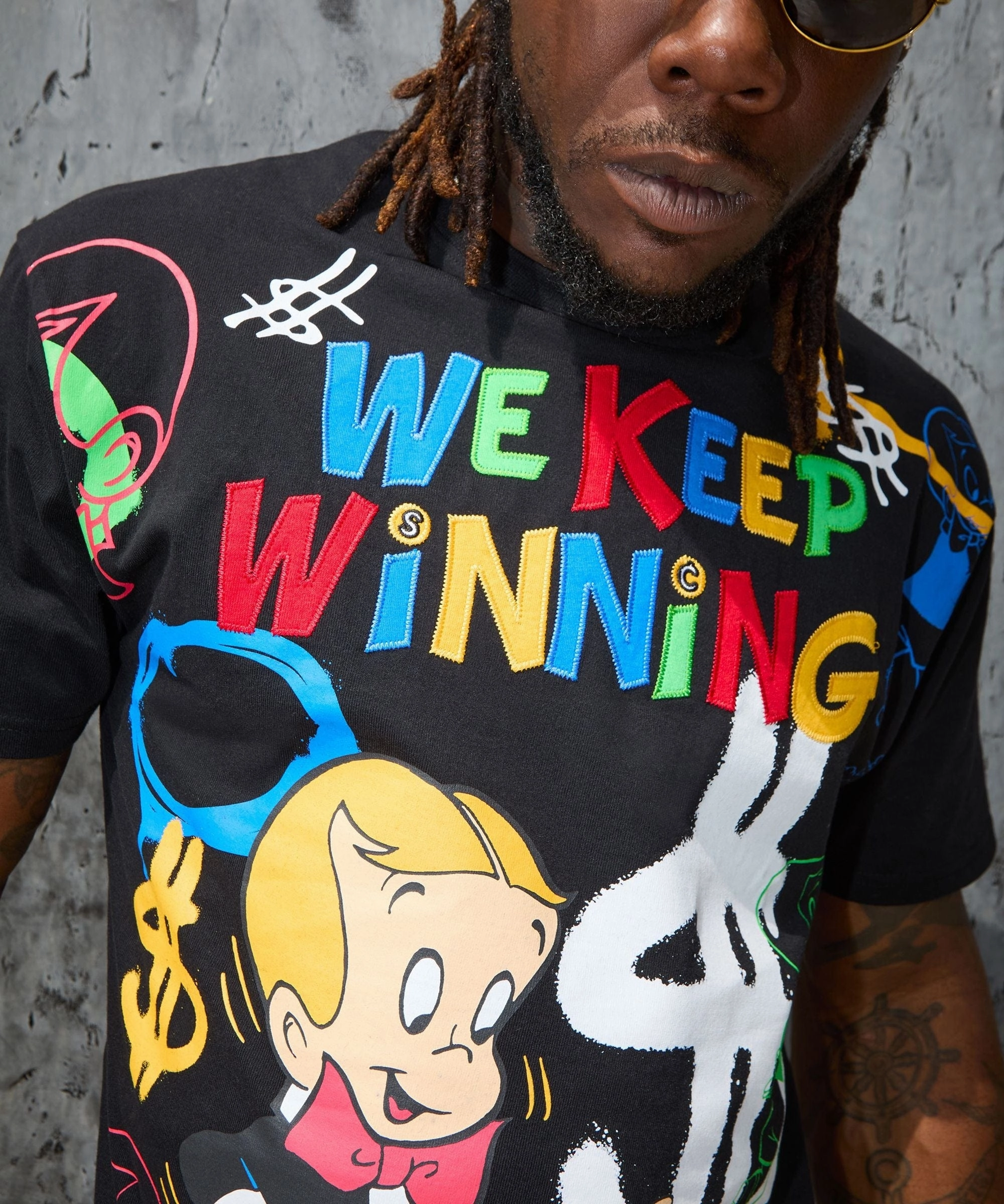 Lightweight Weave Material Fashionable Look Richie Rich We Keep Winning Applique Short Sleeve Tee - Black